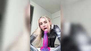 Vega Thompson Rides A Large Toy In Her Spider-Woman Suit